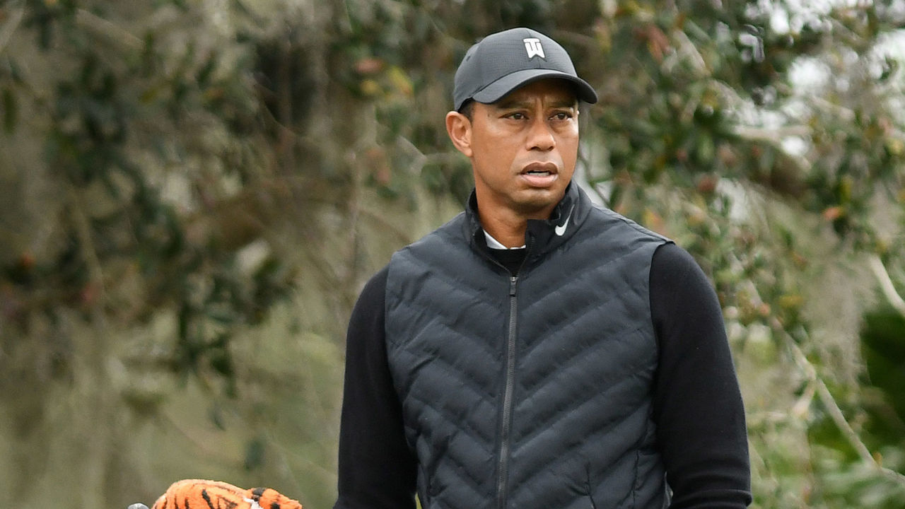 ORLANDO, FLORIDA, UNITED STATES - 2020/12/17: Tiger Woods prepares to tee off on the 10th hole during the pro-am round at the PNC Championship golf tournament at the Ritz-Carlton Golf Club. Woods is paired with his 11-year-old son Charlie (left).