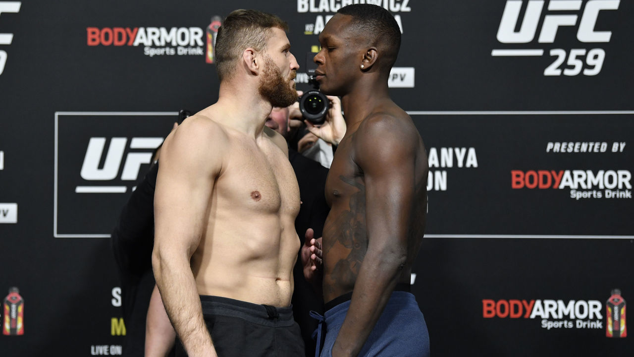 LAS VEGAS, NEVADA - MARCH 05: (L-R) Opponents Jan Blachowicz of Poland and Israel Adesanya of Nigeria face off during the UFC 259 weigh-in at UFC APEX on March 05, 2021 in Las Vegas, Nevada.