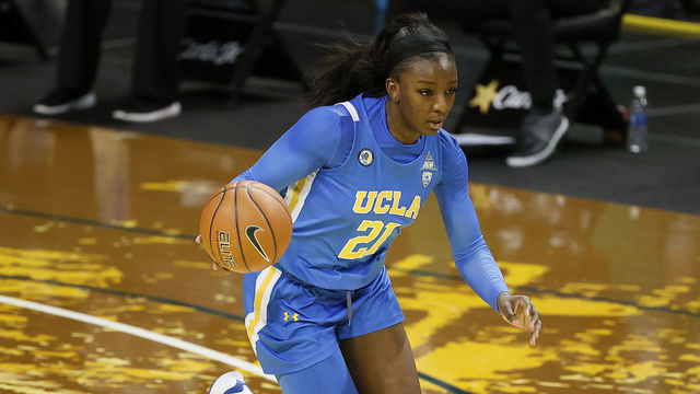 EUGENE, OREGON - JANUARY 03: Michaela Onyenwere #21 of the UCLA Bruins dribbles the ball during the first quarter against the Oregon Ducks at Matthew Knight Arena on January 03, 2021 in Eugene, Oregon.