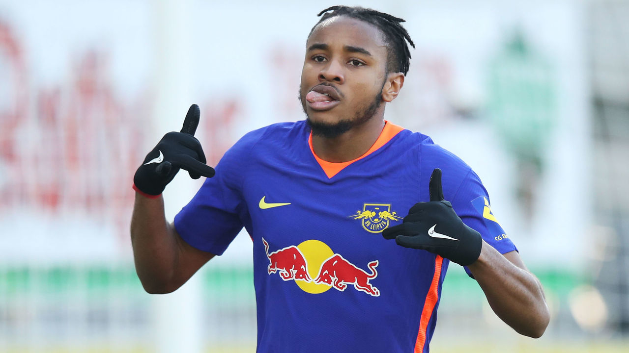 06 March 2021, Baden-Wuerttemberg, Freiburg Im Breisgau: Football: Bundesliga, SC Freiburg - RB Leipzig, Matchday 24 at Schwarzwald-Stadion. Leipzig midfielder Christopher Nkunku celebrates after scoring the 0:1 goal. Photo: Tom Weller/dpa