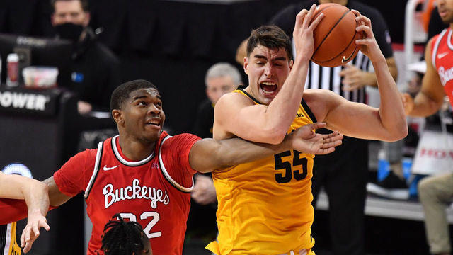 COLUMBUS, OH - FEBRUARY 28: Luka Garza #55 of the Iowa Hawkeyes pulls down a defensive rebound in front of E.J. Liddell #32 of the Ohio State Buckeyes in the first half at Value City Arena in Columbus, Ohio on February 28, 2021.