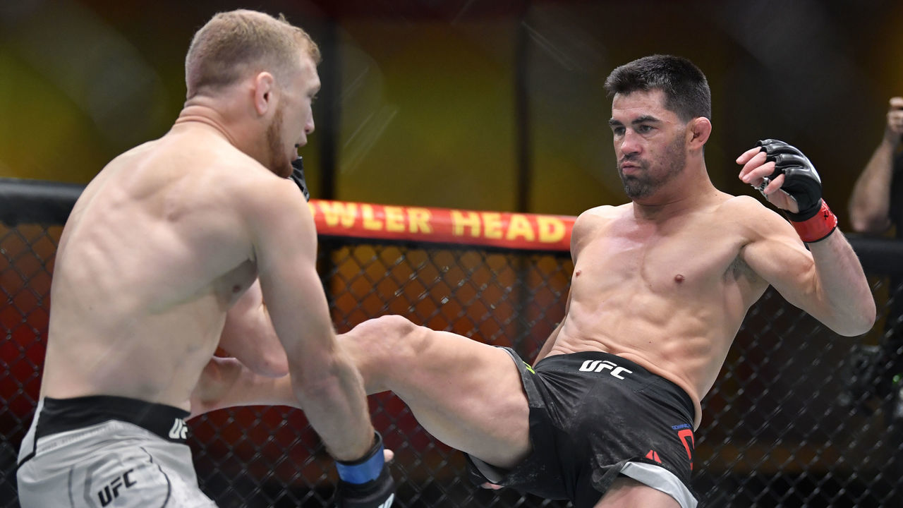 LAS VEGAS, NEVADA - MARCH 06: (R-L) Dominick Cruz kicks Casey Kenney in their bantamweight fight during the UFC 259 event at UFC APEX on March 06, 2021 in Las Vegas, Nevada.