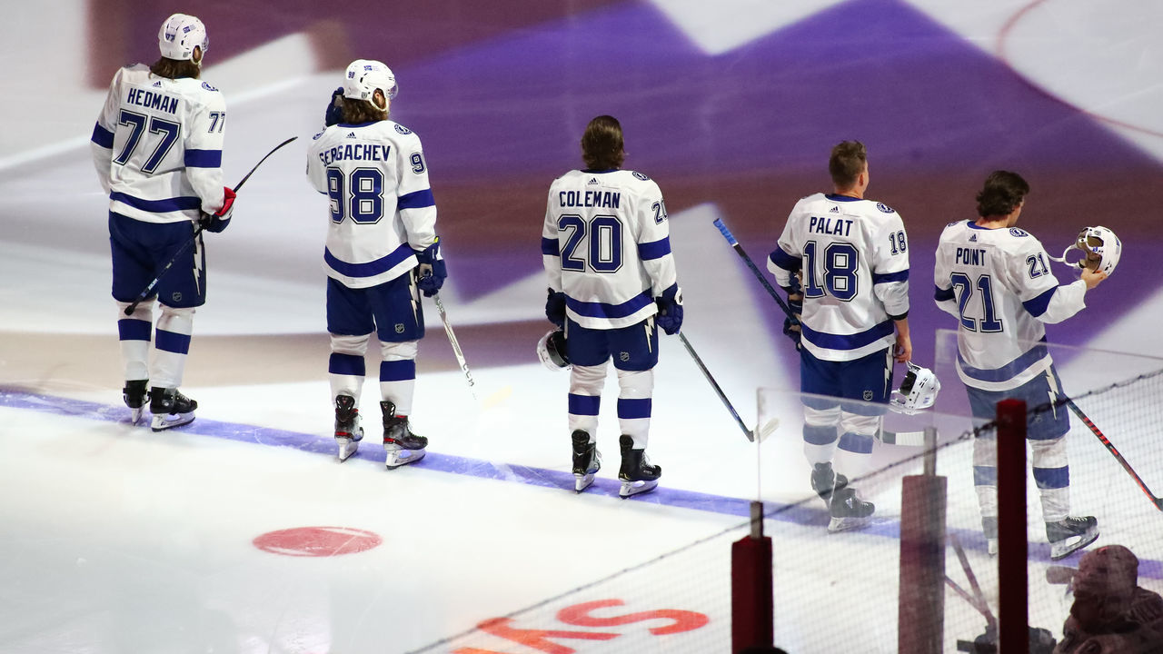RALEIGH, NC - FEBRUARY 22: Tampa Bay Lightning lines up on the blue line during the National Anthem just before the 1st period of the Carolina Hurricanes vs Tampa Bay Lightning on February 22nd, 2021 at PNC Arena in Raleigh, NC.