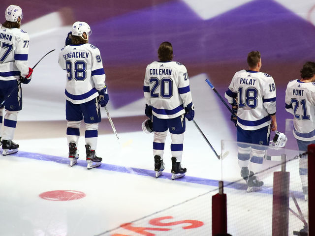 RALEIGH, NC - FEBRUARY 22: Tampa Bay Lightning lines up on the blue line during the National Anthem just before the 1st period of the Carolina Hurricanes vs Tampa Bay Lightning on February 22nd, 2021 at PNC Arena in Raleigh, NC.