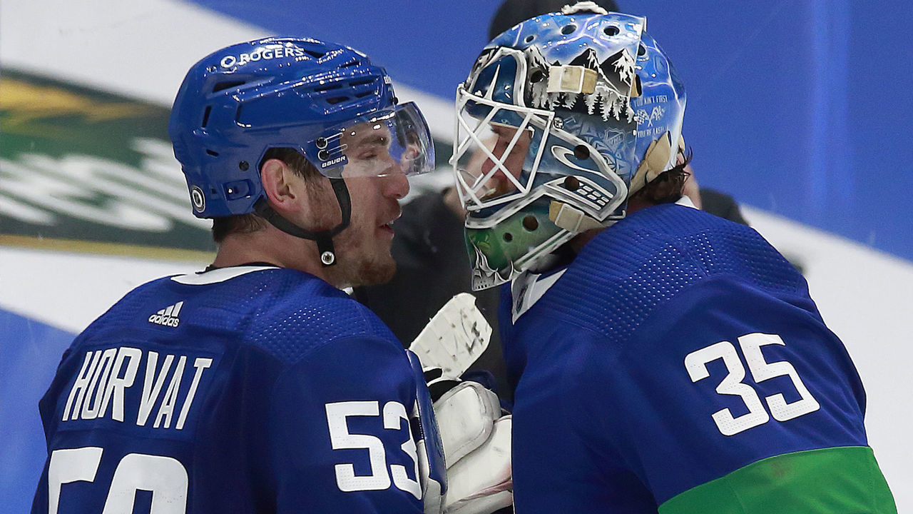 VANCOUVER, BC - MARCH 6: Bo Horvat #53 of the Vancouver Canucks celebrates with teammate Thatcher Demko #35 after winning their NHL game against the Toronto Maple Leafs at Rogers Arena on March 6, 2021 in Vancouver, British Columbia, Canada. Vancouver won 4-2.
