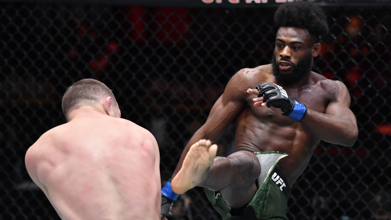 LAS VEGAS, NEVADA - MARCH 06: (R-L) Aljamain Sterling kicks Petr Yan of Russia in their UFC bantamweight championship fight during the UFC 259 event at UFC APEX on March 06, 2021 in Las Vegas, Nevada.