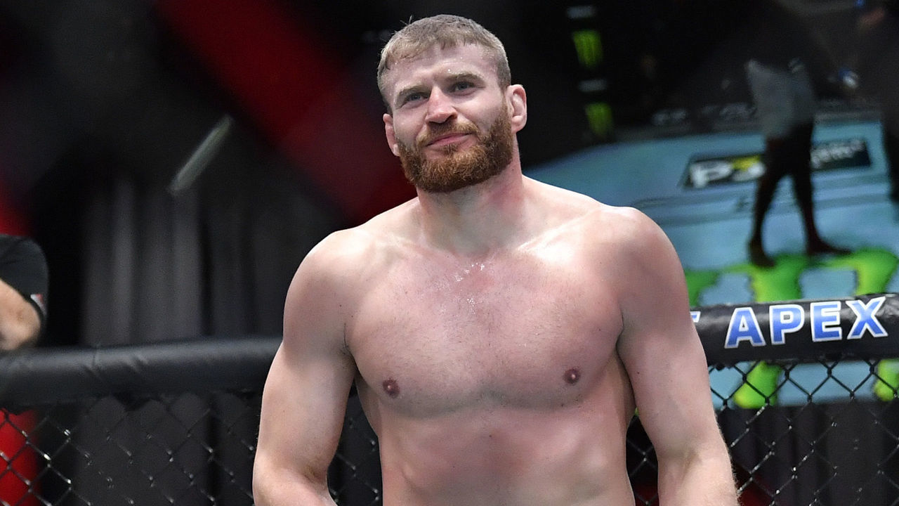 LAS VEGAS, NEVADA - MARCH 06: (R-L) Jan Blachowicz of Poland reacts after receiving an accidental low blow from Israel Adesanya of Nigeria in their UFC light heavyweight championship fight during the UFC 259 event at UFC APEX on March 06, 2021 in Las Vegas, Nevada.