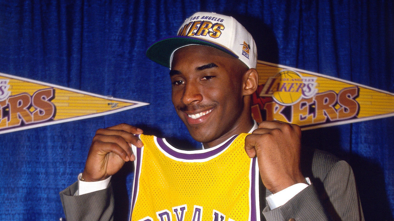 INGLEWOOD, CA - JULY 11: Kobe Bryant holds a #8 Los Angeles Lakers jersey after being the 13th overall pick in the 1996 NBA Draft by the Charlotte Hornets who then traded his draft rights to the Los Angeles Lakers on July 11, 1996 in Inglewood, California. NOTE TO USER: User expressly acknowledges and agrees that, by downloading and/or using this Photograph, user is consenting to the terms and conditions of the Getty Images License Agreement. Mandatory Copyright Notice: Copyright 1996 NBAE