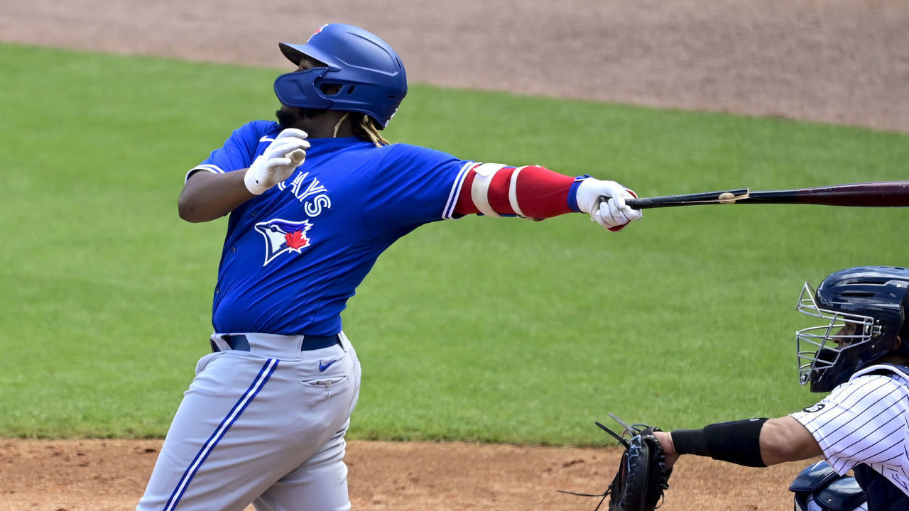 TAMPA, FLORIDA - FEBRUARY 28: Vladimir Guerrero Jr. #27 of the Toronto Blue Jays breaks his bat and hits a single to center field during the third inning against the New York Yankees during a spring training game at George M. Steinbrenner Field on February 28, 2021 in Tampa, Florida.