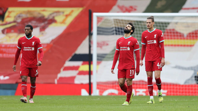 LIVERPOOL, ENGLAND - MARCH 07: Mohamed Salah of Liverpool looks dejected with team mates Georginio Wijnaldum (L) and Rhys Williams (R) after Fulham's first goal scored by Mario Lemina (Not pictured) during the Premier League match between Liverpool and Fulham at Anfield on March 07, 2021 in Liverpool, England. Sporting stadiums around the UK remain under strict restrictions due to the Coronavirus Pandemic as Government social distancing laws prohibit fans inside venues resulting in games being played behind closed doors.
