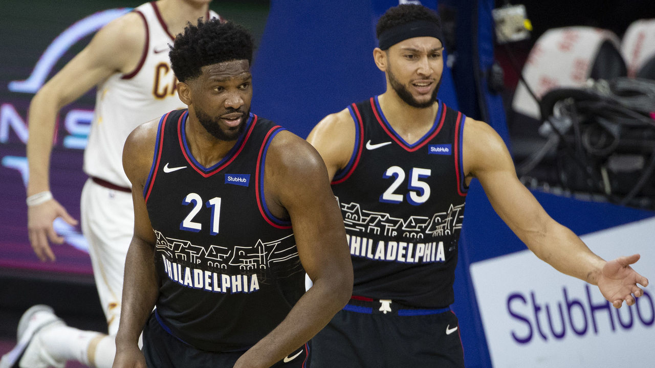 PHILADELPHIA, PA - FEBRUARY 27: Joel Embiid #21 and Ben Simmons #25 of the Philadelphia 76ers talk to referee Ashley Moyer-Gleich #13 against the Cleveland Cavaliers at Wells Fargo Center on February 27, 2021 in Philadelphia, Pennsylvania.