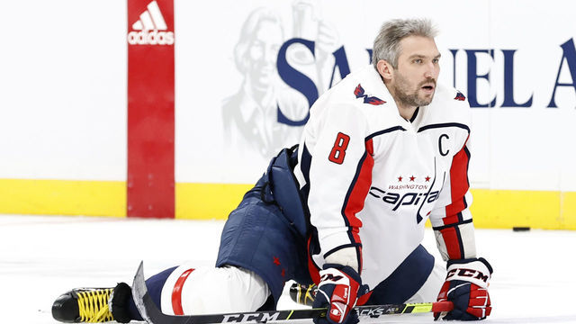 BOSTON, MA - MARCH 05: Washington Capitals left wing Alex Ovechkin (8) stretches out in warm up before a game between the Boston Bruins and the Washington Capitals on March 5, 2021, at TD Garden in Boston, Massachusetts.