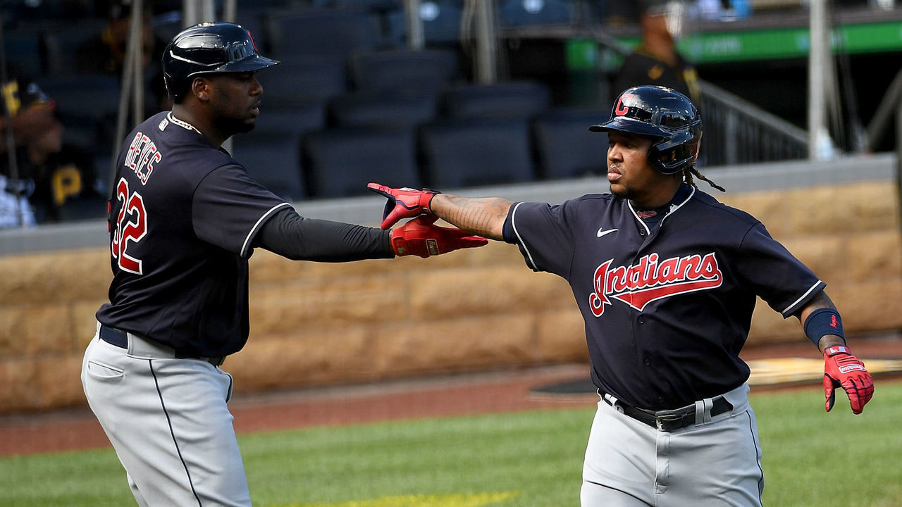 PITTSBURGH, PA - JULY 22: Jose Ramirez #11 of the Cleveland Indians celebrates with Franmil Reyes #32 after coming around to score on an error by Adam Frazier #26 of the Pittsburgh Pirates in the first inning during the exhibition game at PNC Park on July 22, 2020 in Pittsburgh, Pennsylvania.