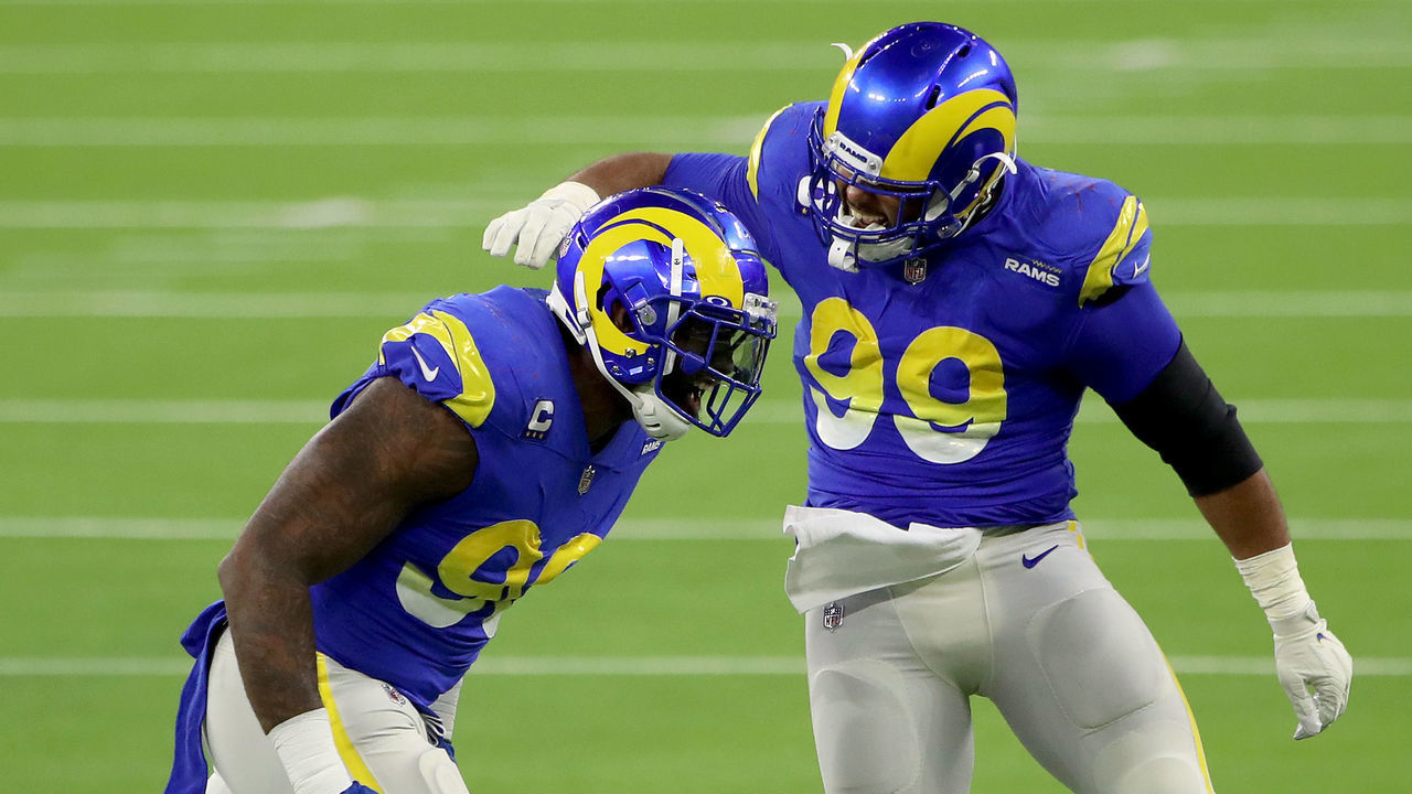 INGLEWOOD, CALIFORNIA - DECEMBER 10: Aaron Donald #99 and Michael Brockers #90 of the Los Angeles Rams celebrate a sack during the third quarter in the game against the New England Patriots at SoFi Stadium on December 10, 2020 in Inglewood, California.