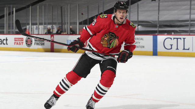 CHICAGO, ILLINOIS - FEBRUARY 04: Connor Murphy #5 of the Chicago Blackhawks looks down the ice in the second period against the Carolina Hurricanes at the United Center on February 04, 2021 in Chicago, Illinois.