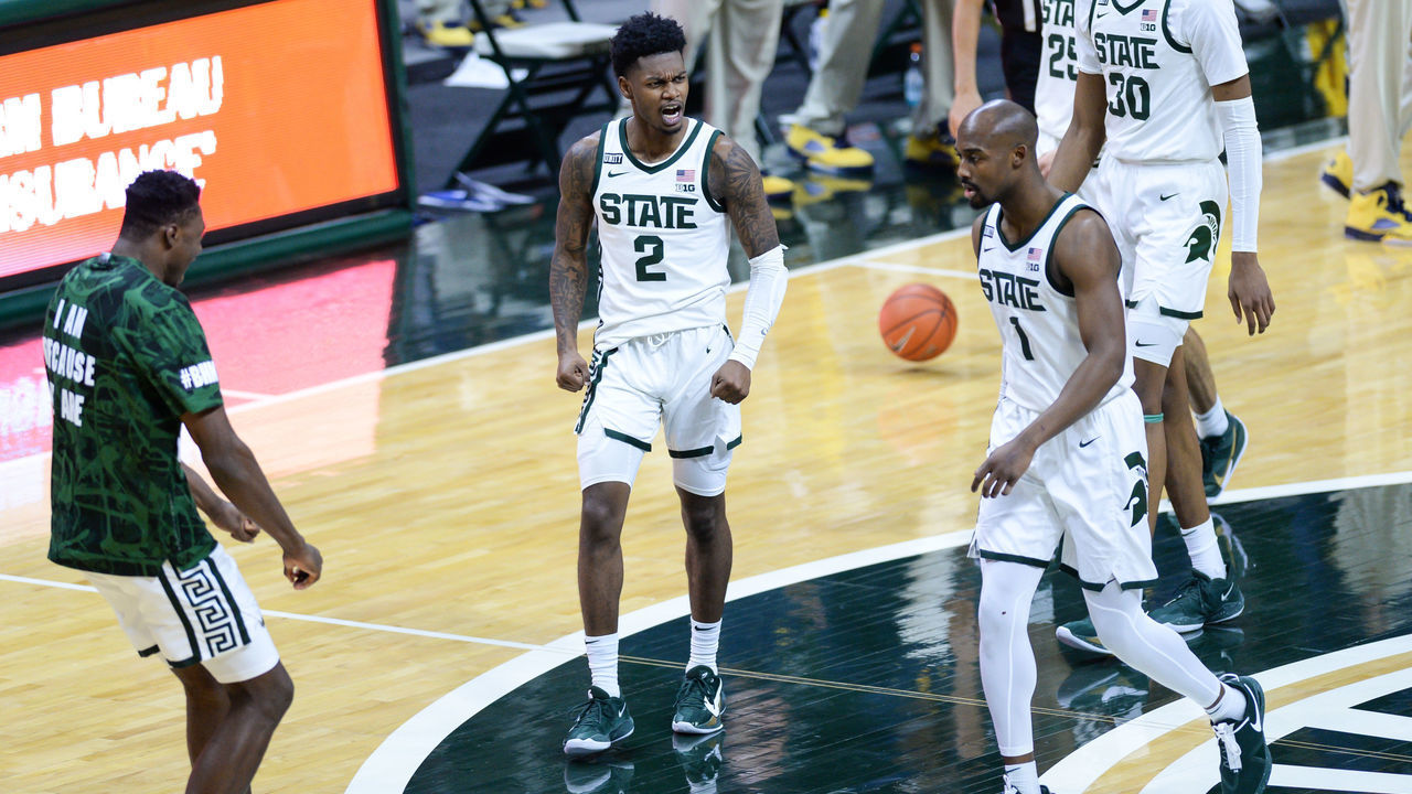 EAST LANSING, MI - MARCH 07: Michigan State Spartans guards Rocket Watts (2) and Joshua Langford (1) celebrate Langford's three-pointer during a college basketball game between the Michigan State Spartans and the Michigan Wolverines on March 7, 2021 at the Breslin Student Events Center in East Lansing, MI.