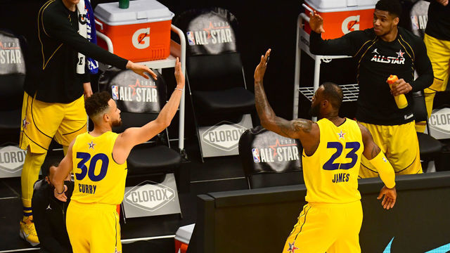 ATLANTA, GA - MARCH 7: Stephen Curry #30 of Team LeBron high fives LeBron James #23 of Team LeBron during the 70th NBA All Star Game as part of 2021 NBA All Star Weekend on March 7, 2021 at State Farm Arena in Atlanta, Georgia. Mandatory Copyright Notice: Copyright 2021 NBAE