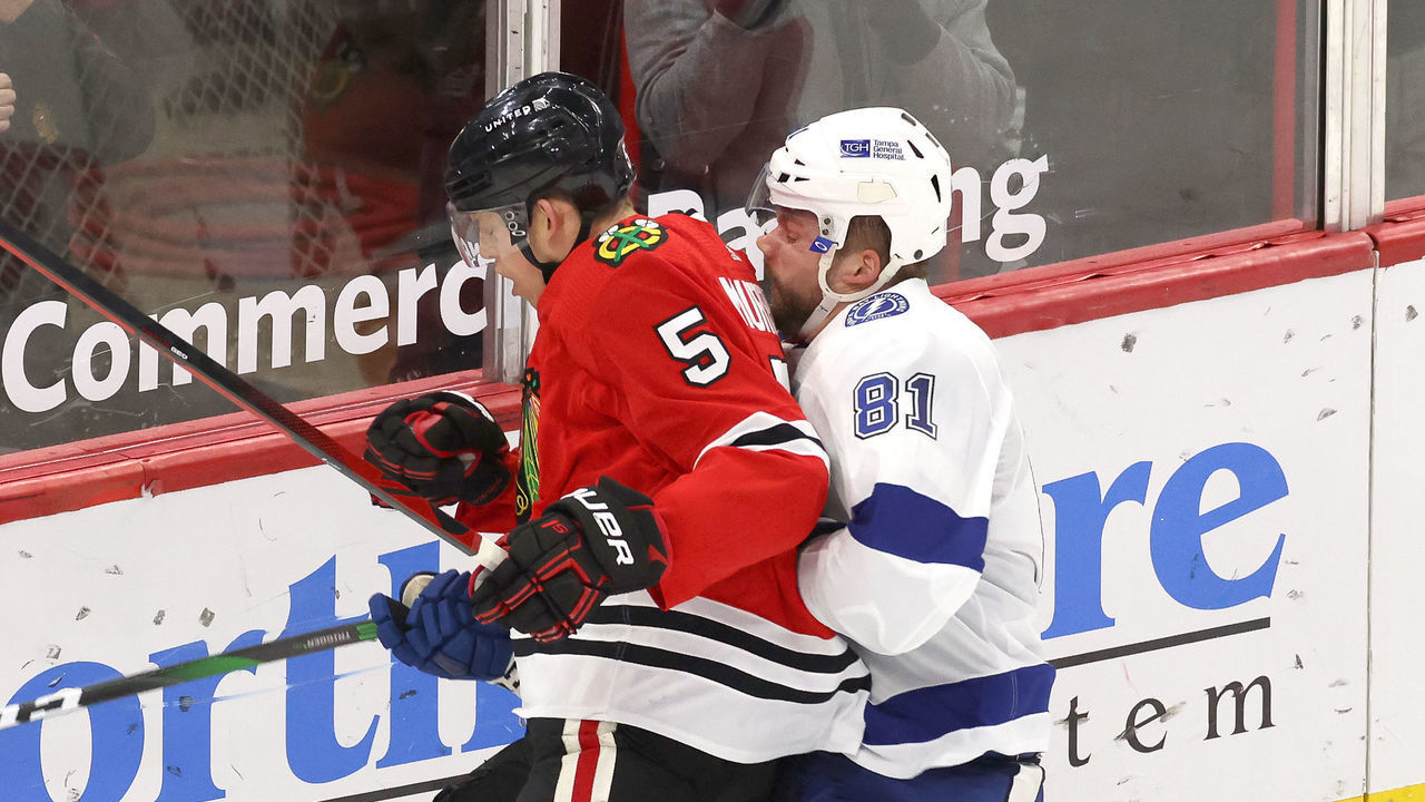 CHICAGO, IL - MARCH 07: Chicago Blackhawks defenseman Connor Murphy (5) collides wih Tampa Bay Lightning defenseman Erik Cernak (81) in action during a game between the Chicago Blackhawks and the Tampa Bay Lightning at the United Center on March 7, 2021 in Chicago, Illinois.