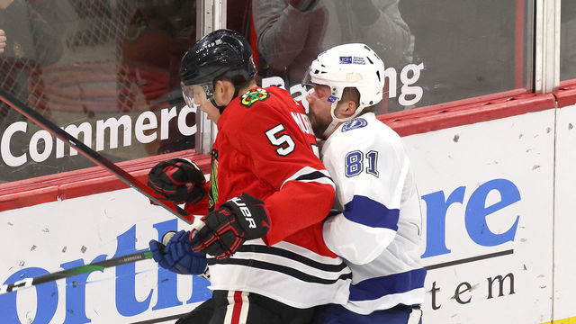 CHICAGO, IL - MARCH 07: Chicago Blackhawks defenseman Connor Murphy (5) collides wih Tampa Bay Lightning defenseman Erik Cernak (81) in action during a game between the Chicago Blackhawks and the Tampa Bay Lightning at the United Center on March 7, 2021 in Chicago, Illinois.