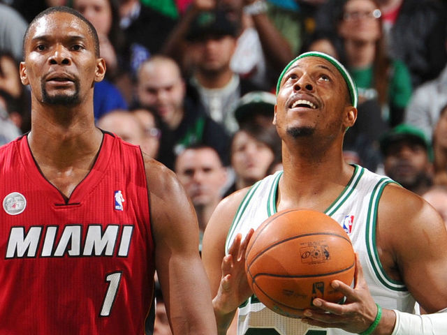 BOSTON, MA - MARCH 18: Paul Pierce #34 of the Boston Celtics holds the ball after a play against Chris Bosh #1 of the Miami Heat on March 18, 2013 at the TD Garden in Boston, Massachusetts. Mandatory Copyright Notice: Copyright 2013 NBAE