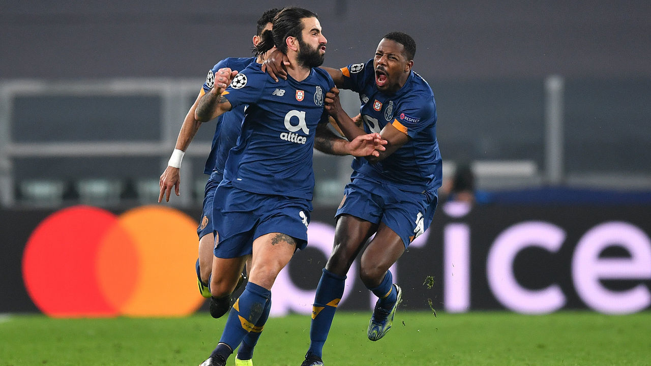 TURIN, ITALY - MARCH 09: Sergio Oliveira of Porto celebrates with Wilson Manafa after scoring their side's second goal during the UEFA Champions League Round of 16 match between Juventus and FC Porto at Juventus Arena on March 09, 2021 in Turin, Italy. Sporting stadiums around Italy remain under strict restrictions due to the Coronavirus Pandemic as Government social distancing laws prohibit fans inside venues resulting in games being played behind closed doors.