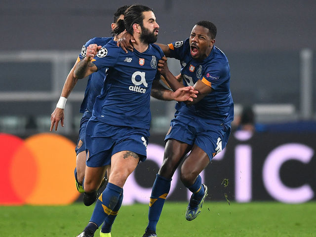 TURIN, ITALY - MARCH 09: Sergio Oliveira of Porto celebrates with Wilson Manafa after scoring their side's second goal during the UEFA Champions League Round of 16 match between Juventus and FC Porto at Juventus Arena on March 09, 2021 in Turin, Italy. Sporting stadiums around Italy remain under strict restrictions due to the Coronavirus Pandemic as Government social distancing laws prohibit fans inside venues resulting in games being played behind closed doors.