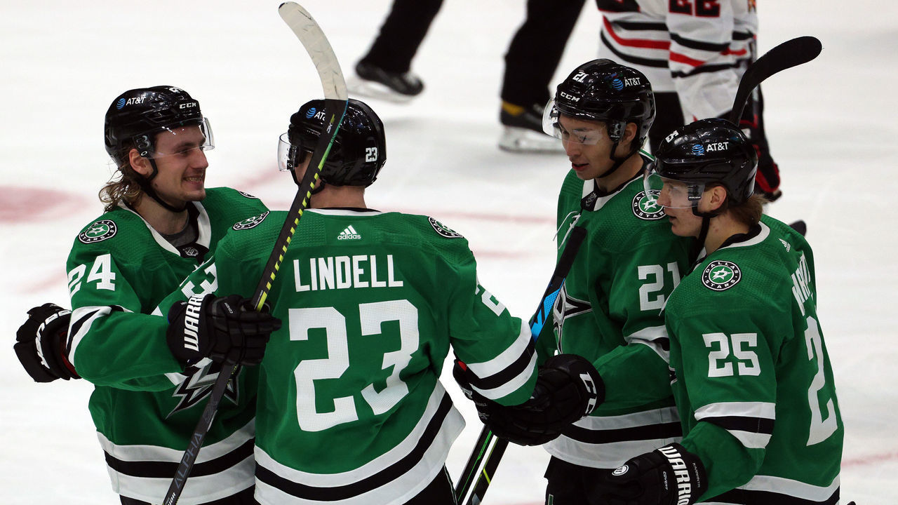 DALLAS, TEXAS - MARCH 09: (L-R) Roope Hintz #24, Esa Lindell #23, Jason Robertson #21 and Joel Kiviranta #25 of the Dallas Stars celebrate a goal against the Chicago Blackhawks in the second period at American Airlines Center on March 09, 2021 in Dallas, Texas.