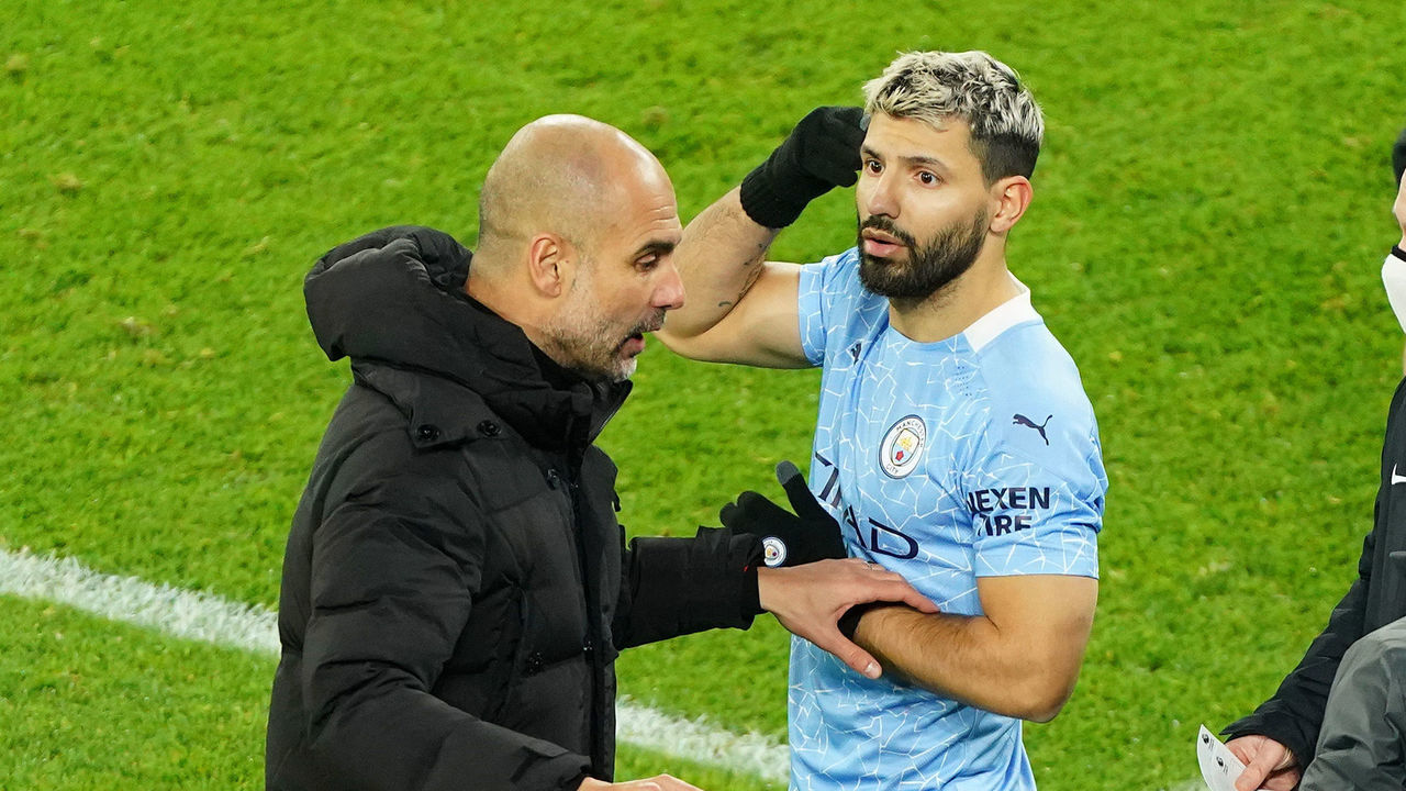 MANCHESTER, ENGLAND - DECEMBER 15: Pep Guardiola, Manager of Manchester City talks with Sergio Aguero of Manchester City before coming on as a substitute during the Premier League match between Manchester City and West Bromwich Albion at Etihad Stadium on December 15, 2020 in Manchester, England. The match will be played without fans, behind closed doors as a Covid-19 precaution.