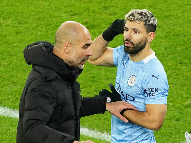 MANCHESTER, ENGLAND - DECEMBER 15: Pep Guardiola, Manager of Manchester City talks with Sergio Aguero of Manchester City before coming on as a substitute during the Premier League match between Manchester City and West Bromwich Albion at Etihad Stadium on December 15, 2020 in Manchester, England. The match will be played without fans, behind closed doors as a Covid-19 precaution.