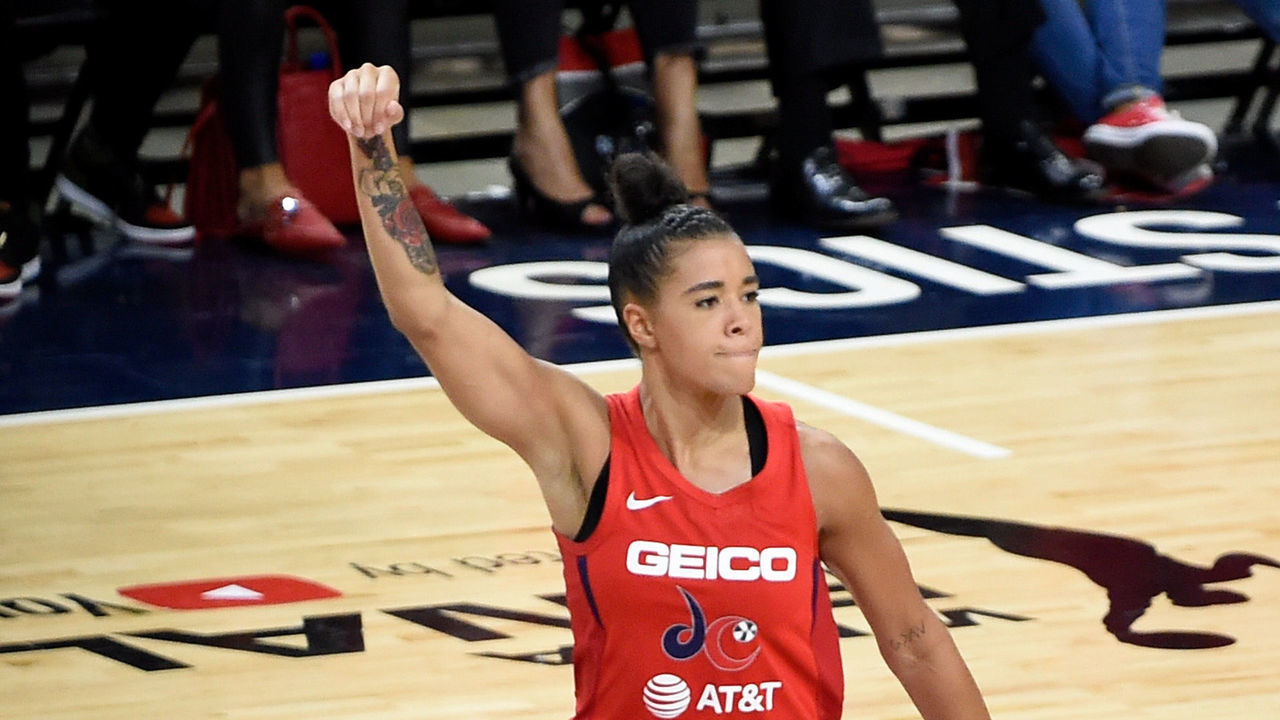 WASHINGTON, DC - OCTOBER 10: Natasha Cloud #9 of the Washington Mystics celebrates against the Connecticut Sun during Game 5 of the 2019 WNBA Finals at St Elizabeths East Entertainment & Sports Arena on October 10, 2019 in Washington, DC.