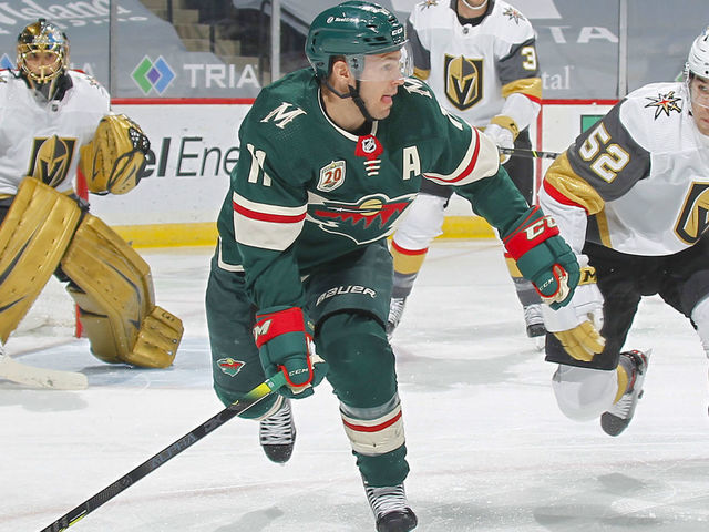SAINT PAUL, MN - MARCH 10: Zach Parise #11 of the Minnesota Wild and Dylan Coghlan #52 of the Vegas Golden Knights skate to the puck during the game at the Xcel Energy Center on March 10, 2021 in Saint Paul, Minnesota.