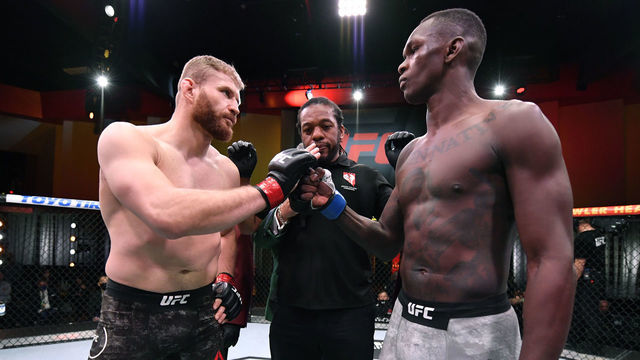 LAS VEGAS, NEVADA - MARCH 06: (L-R) Opponents Jan Blachowicz of Poland and Israel Adesanya of Nigeria face off prior to their UFC light heavyweight championship fight during the UFC 259 event at UFC APEX on March 06, 2021 in Las Vegas, Nevada.