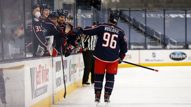 COLUMBUS, OH - MARCH 2: Jack Roslovic #96 of the Columbus Blue Jackets is congratulated by his teammates after scoring a goal during the game against the Detroit Red Wings at Nationwide Arena on March 2, 2021 in Columbus, Ohio.