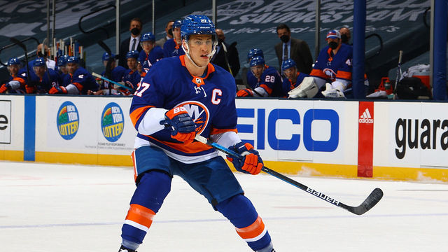 UNIONDALE, NEW YORK - MARCH 07: Anders Lee #27 of the New York Islanders in action against the Buffalo Sabres at Nassau Coliseum on March 07, 2021 in Uniondale, New York. New York Islanders defeated the Buffalo Sabres 5-2.
