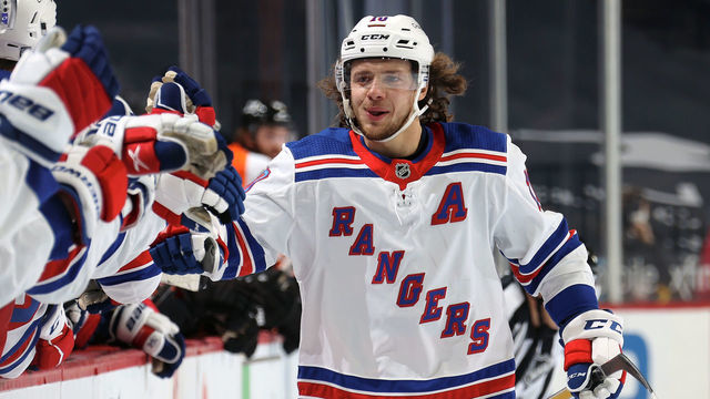 PHILADELPHIA, PA - FEBRUARY 18: Artemi Panarin #10 of the New York Rangers celebrates his shootout goal against the Philadelphia Flyers with his teammates on the bench at the Wells Fargo Center on February 18, 2021 in Philadelphia, Pennsylvania. His goal would be the game-winning goal as the Rangers defeated the Flyers 3-2 in a shootout.