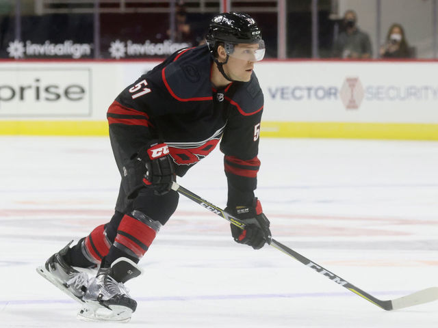 RALEIGH, NC - JANUARY 28: Jake Gardiner #51 of the Carolina Hurricanes skates for position on the ice during an NHL game against the Tampa Bay Lightning on January 28, 2021 at PNC Arena in Raleigh, North Carolina.