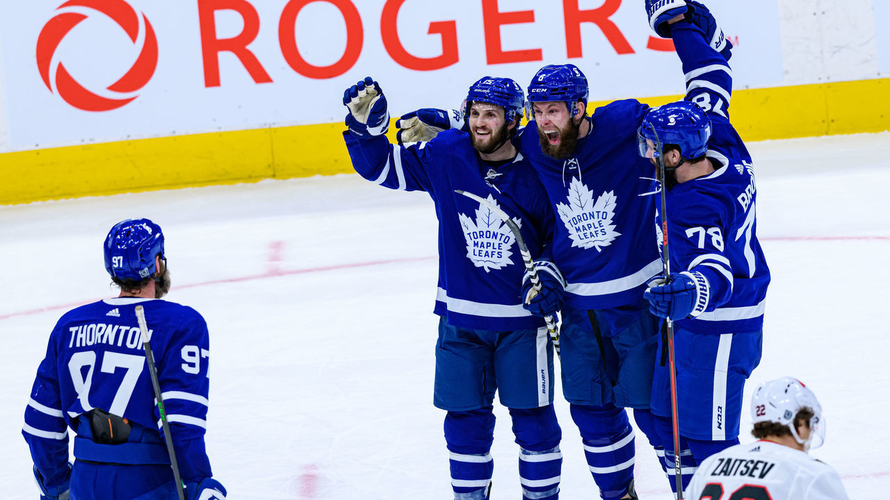 TORONTO, ON - FEBRUARY 17: Toronto Maple Leafs Center Alexander Kerfoot (15) celebrates his goal with Toronto Maple Leafs Defenceman Jake Muzzin (8), Defenceman T.J. Brodie (78) and Center Joe Thornton (97) during the third period of the NHL regular season game between the Ottawa Senators and the Toronto Maple Leafs on February 17, 2021, at Scotiabank Arena in Toronto, ON, Canada.