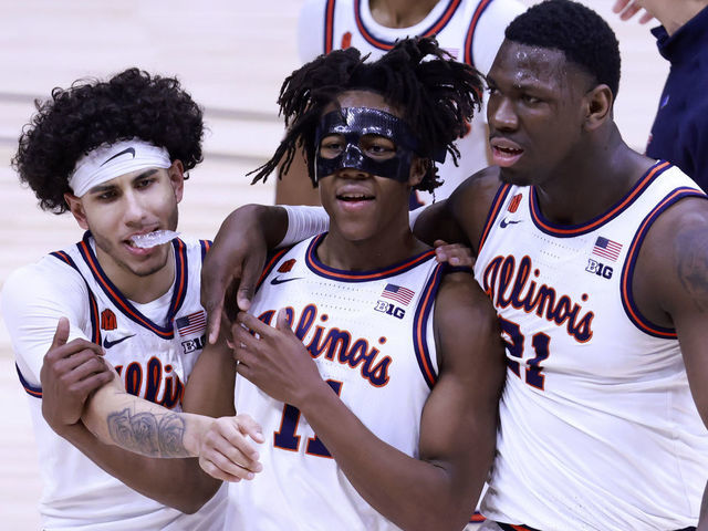 INDIANAPOLIS, INDIANA - MARCH 13: Ayo Dosunmu #11, Kofi Cockburn #21 and Andre Curbelo #5 of the Illinois Fighting Illini walk off the court after a win over the Iowa Hawkeyes in the Big Ten men's basketball tournament semifinals at Lucas Oil Stadium on March 13, 2021 in Indianapolis, Indiana.