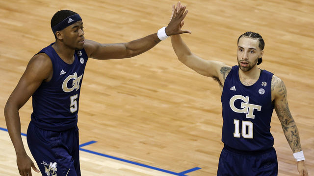 GREENSBORO, NORTH CAROLINA - MARCH 13: Moses Wright #5 and Jose Alvarado #10 of the Georgia Tech Yellow Jackets react following a basket during the second half of the ACC Men's Basketball Tournament championship game against the Florida State Seminoles at Greensboro Coliseum on March 13, 2021 in Greensboro, North Carolina.