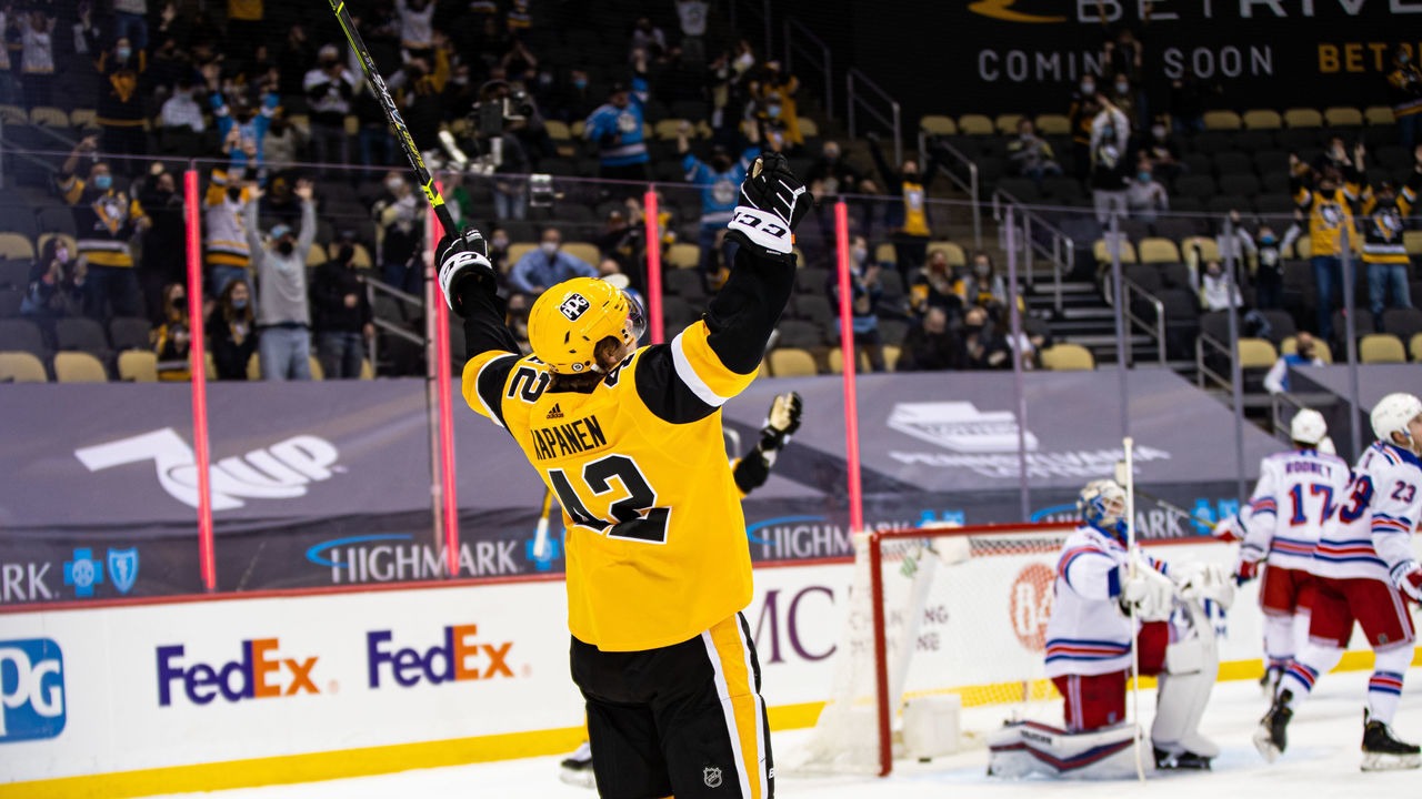 PITTSBURGH, PA - MARCH 09: Pittsburgh Penguins Right Wing Kasperi Kapanen (42) reacts after scoring a goal during the NHL game between the Pittsburgh Penguins and the New York Rangers on March 9, 2021, at PPG Paints Arena in Pittsburgh, PA.