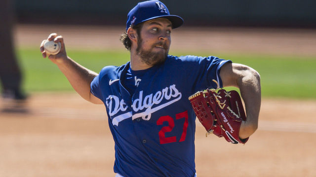 GLENDALE, AZ - MARCH 06: Trevor Bauer #27 of the Los Angeles Dodgers delivers a pitch against the San Diego Padres at Camelback Ranch on March 6, 2021 in Glendale, Arizona.