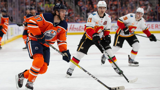 EDMONTON, AB - JANUARY 29: Connor McDavid #97 of the Edmonton Oilers skates against Mikael Backlund #11 of the Calgary Flames during the second period at Rogers Place on January 29, 2020, in Edmonton, Canada.