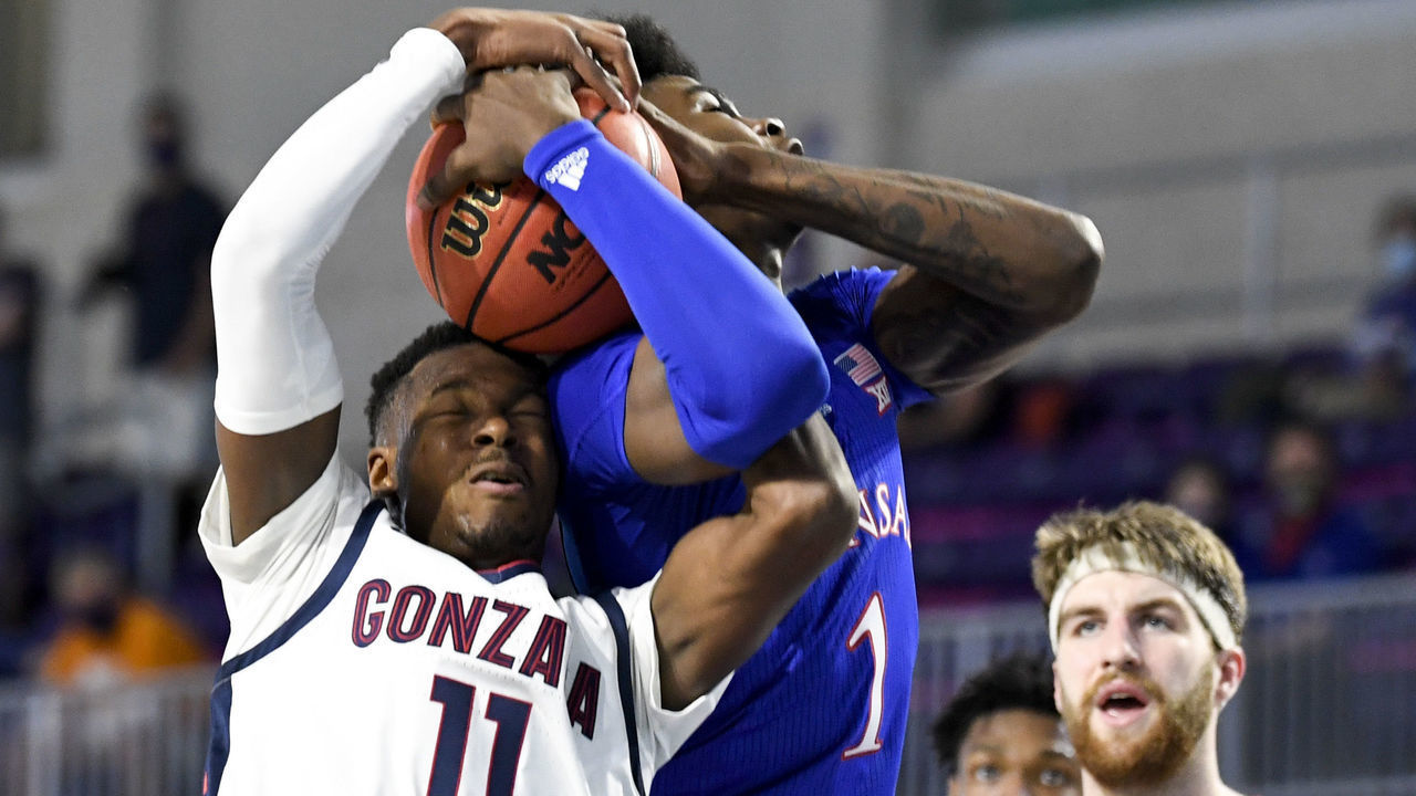 FORT MYERS, FLORIDA - NOVEMBER 26: Tyon Grant-Foster #1 of the Kansas Jayhawks and Joel Ayayi #11 of the Gonzaga Bulldogs fight for a rebound during the first half during the Rocket Mortgage Fort Myers Tip-Off at Suncoast Credit Union Arena on November 26, 2020 in Fort Myers, Florida.
