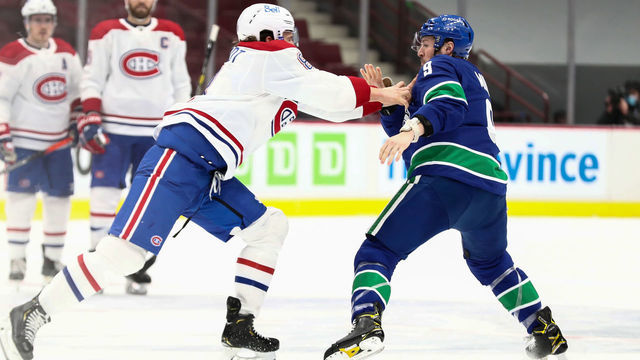 VANCOUVER, BC - MARCH 10: Montreal Canadiens Defenceman Ben Chiarot (8) and Vancouver Canucks Left Wing J.T. Miller (9) fight during their NHL game at Rogers Arena on March 10, 2021 in Vancouver, British Columbia, Canada.