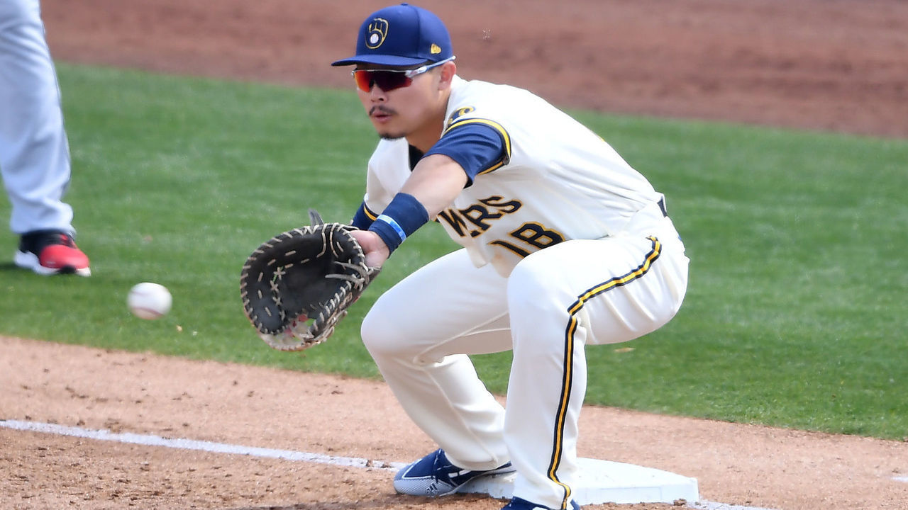PHOENIX, ARIZONA - MARCH 04: Keston Hiura #18 of the the Milwaukee Brewers waits for a throw while covering first base against the Cleveland Indians during a spring training game at American Family Fields of Phoenix on March 04, 2021 in Phoenix, Arizona.