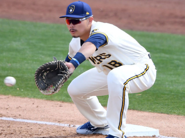 PHOENIX, ARIZONA - MARCH 04: Keston Hiura #18 of the the Milwaukee Brewers waits for a throw while covering first base against the Cleveland Indians during a spring training game at American Family Fields of Phoenix on March 04, 2021 in Phoenix, Arizona.