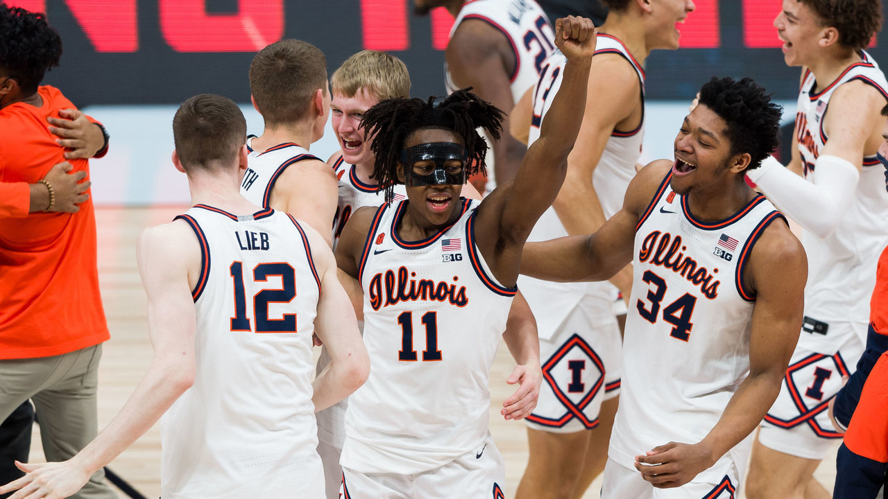 INDIANAPOLIS, IN - MARCH 14: Illinois Fighting Illini guard Ayo Dosunmu (11) and Illinois Fighting Illini center Jermaine Hamlin (34) celebrate after winning the men's Big Ten tournament college basketball game between the Ohio State Buckeyes and Illinois Fighting Illini on March 14, 2021, at Lucas Oil Stadium in Indianapolis, IN.