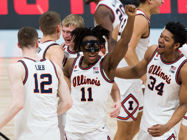 INDIANAPOLIS, IN - MARCH 14: Illinois Fighting Illini guard Ayo Dosunmu (11) and Illinois Fighting Illini center Jermaine Hamlin (34) celebrate after winning the men's Big Ten tournament college basketball game between the Ohio State Buckeyes and Illinois Fighting Illini on March 14, 2021, at Lucas Oil Stadium in Indianapolis, IN.