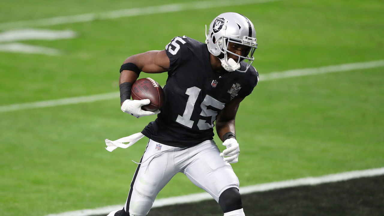 LAS VEGAS, NEVADA - DECEMBER 13: Las Vegas Raiders wide receiver Nelson Agholor #15 scores a touchdown against Indianapolis Colts strong safety Khari Willis #37 during the second quarter at Allegiant Stadium on December 13, 2020 in Las Vegas, Nevada.