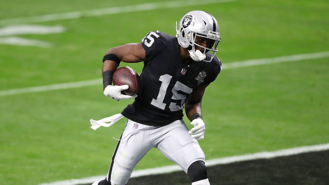 LAS VEGAS, NEVADA - DECEMBER 13: Las Vegas Raiders wide receiver Nelson Agholor #15 scores a touchdown against Indianapolis Colts strong safety Khari Willis #37 during the second quarter at Allegiant Stadium on December 13, 2020 in Las Vegas, Nevada.